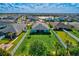 A tranquil community showcasing lush lawns, serene water views, and pristine white fences at 17732 Wayside Bnd, Punta Gorda, FL 33982