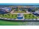 Community view featuring a lakeside gazebo, walkways, and lush green spaces at 17732 Wayside Bnd, Punta Gorda, FL 33982