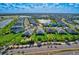 Aerial shot of a lakeside community featuring vibrant landscaping and serene water views at 17732 Wayside Bnd, Punta Gorda, FL 33982