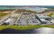 Aerial view of the complex showing the buildings, parking lots and a lake nearby at 17732 Wayside Bnd, Punta Gorda, FL 33982