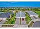 Aerial view of a well-maintained community with lush green lawns and meticulously landscaped yards at 17732 Wayside Bnd, Punta Gorda, FL 33982