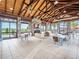 Clubhouse interior featuring a fireplace, dining area, and comfortable seating with a lake view at 17732 Wayside Bnd, Punta Gorda, FL 33982