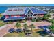 Modern commercial building with solar panels surrounded by lush landscaping and water views at 17732 Wayside Bnd, Punta Gorda, FL 33982