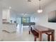 Open-concept living room and kitchen area with modern furnishings and tile flooring at 17732 Wayside Bnd, Punta Gorda, FL 33982