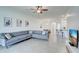 Open concept living room featuring tile floors and views of kitchen and dining area at 17732 Wayside Bnd, Punta Gorda, FL 33982