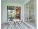 Inviting patio area with comfortable seating and views of the interior and exterior at 17732 Wayside Bnd, Punta Gorda, FL 33982