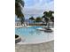 Stunning pool with lounge chairs and palm trees at 17732 Wayside Bnd, Punta Gorda, FL 33982