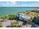 Elevated view of a waterfront restaurant surrounded by palm trees with water views at 17732 Wayside Bnd, Punta Gorda, FL 33982