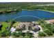 Aerial view of a luxury estate with beautiful landscaping and lake view at 18826 Ganton Ave, Lakewood Ranch, FL 34202