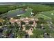 Overhead view of the lavish clubhouse featuring manicured landscaping, parking, and scenic views at 18826 Ganton Ave, Lakewood Ranch, FL 34202
