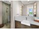 Contemporary bathroom featuring a glass-enclosed shower and a modern vanity with ample counter space at 18826 Ganton Ave, Lakewood Ranch, FL 34202