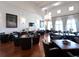 Sophisticated dining area with hardwood floors, elegant lighting, and comfortable seating, creating a warm and inviting atmosphere at 18826 Ganton Ave, Lakewood Ranch, FL 34202
