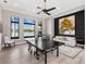Spacious game room with a ping pong table, lake views, and a modern seating area at 18826 Ganton Ave, Lakewood Ranch, FL 34202