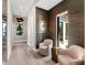 Sitting area in hallway with textured wall and decorative lighting fixture at 18826 Ganton Ave, Lakewood Ranch, FL 34202