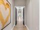 Open hallway with painting hanging on wall at 18826 Ganton Ave, Lakewood Ranch, FL 34202