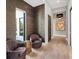 Sitting area in hallway with textured wall and decorative lighting fixture at 18826 Ganton Ave, Lakewood Ranch, FL 34202