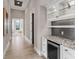 Hallway with beverage cooler and hallway that leads to living area at 18826 Ganton Ave, Lakewood Ranch, FL 34202