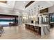 Open kitchen featuring a large island with barstool seating and views of the outdoor living space at 18826 Ganton Ave, Lakewood Ranch, FL 34202