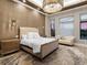 This main bedroom has stylish decor, lots of natural light, and neutral colors for a peaceful, luxurious feeling at 18826 Ganton Ave, Lakewood Ranch, FL 34202