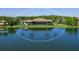 Aerial view of the rear exterior with lake view and screened in patio at 18826 Ganton Ave, Lakewood Ranch, FL 34202