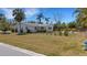 Charming home with a spacious, grassy backyard surrounded by a fence, offering privacy and outdoor space at 2647 Britannia Rd, Sarasota, FL 34231