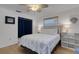 Comfortable bedroom with a ceiling fan, windows with shades, and a bed at 2647 Britannia Rd, Sarasota, FL 34231