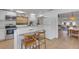 Well-lit kitchen with stainless appliances, breakfast bar, and open to the dining room at 2647 Britannia Rd, Sarasota, FL 34231