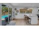 An open kitchen and dining area with access to the pool at 2647 Britannia Rd, Sarasota, FL 34231