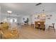 Open-concept living area featuring modern decor, hardwood floors, and a comfortable seating arrangement at 2647 Britannia Rd, Sarasota, FL 34231