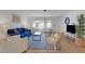 Well-lit living room with contemporary furniture, large windows, and hardwood flooring at 2647 Britannia Rd, Sarasota, FL 34231