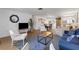 Bright living room with a cozy seating area, modern decor, and hardwood flooring at 2647 Britannia Rd, Sarasota, FL 34231