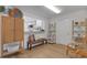 Stylish interior featuring hardwood floors, chic decor, and a cozy reading nook at 2647 Britannia Rd, Sarasota, FL 34231