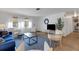 Inviting living room showcases stylish furniture, natural light, and beautiful hardwood floors at 2647 Britannia Rd, Sarasota, FL 34231