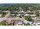 Clear aerial perspective of homes in a quiet area with mature trees and manicured lawns, creating a peaceful ambiance at 2908 Mayflower St, Sarasota, FL 34231