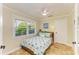 Inviting bedroom with tile flooring, a ceiling fan, and a beach-themed style, perfect for relaxation at 2908 Mayflower St, Sarasota, FL 34231