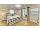 Bright bedroom with French doors, coastal-themed decor, and access to outdoor space at 2908 Mayflower St, Sarasota, FL 34231