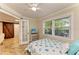 Cozy bedroom featuring a nautical theme, ceiling fan and natural light at 2908 Mayflower St, Sarasota, FL 34231