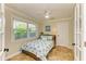 Comfortable bedroom with tile flooring, a window view, and nautical-themed decor at 2908 Mayflower St, Sarasota, FL 34231