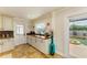 Convenient butler's pantry with custom cabinets, granite counters, and a door leading to the screened pool area at 2908 Mayflower St, Sarasota, FL 34231