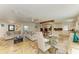 Open living space with living room, dining area and kitchen, featuring tile flooring and neutral colors at 2908 Mayflower St, Sarasota, FL 34231