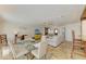 Spacious living room featuring a ceiling fan, neutral decor, and a seamless connection to the dining area at 2908 Mayflower St, Sarasota, FL 34231