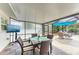 Inviting patio area featuring stylish outdoor furniture and a mounted television at 2908 Mayflower St, Sarasota, FL 34231