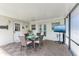 Charming patio featuring outdoor dining with television and view of backyard at 2908 Mayflower St, Sarasota, FL 34231