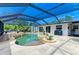 Backyard pool area featuring a spa, lush landscaping, and a seating area perfect for relaxing at 2908 Mayflower St, Sarasota, FL 34231
