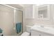 Bathroom featuring a shower with sliding glass doors, a vanity with a mirror, and a toilet at 314 Oak Hill Way # 24, Sarasota, FL 34232