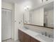 Bright bathroom with double sinks, modern vanity, and ample storage with a view to a shower at 314 Oak Hill Way # 24, Sarasota, FL 34232