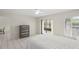 Well-lit bedroom featuring tiled floors, closet space, and an additional bureau for storage space at 314 Oak Hill Way # 24, Sarasota, FL 34232