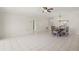 Open concept living and dining area with tile flooring and a classic dining set at 314 Oak Hill Way # 24, Sarasota, FL 34232