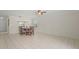 Dining area features tile flooring, neutral walls, and a vintage chandelier at 314 Oak Hill Way # 24, Sarasota, FL 34232