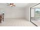 Dining room area featuring tile flooring, neutral walls, and access to an enclosed lanai at 314 Oak Hill Way # 24, Sarasota, FL 34232